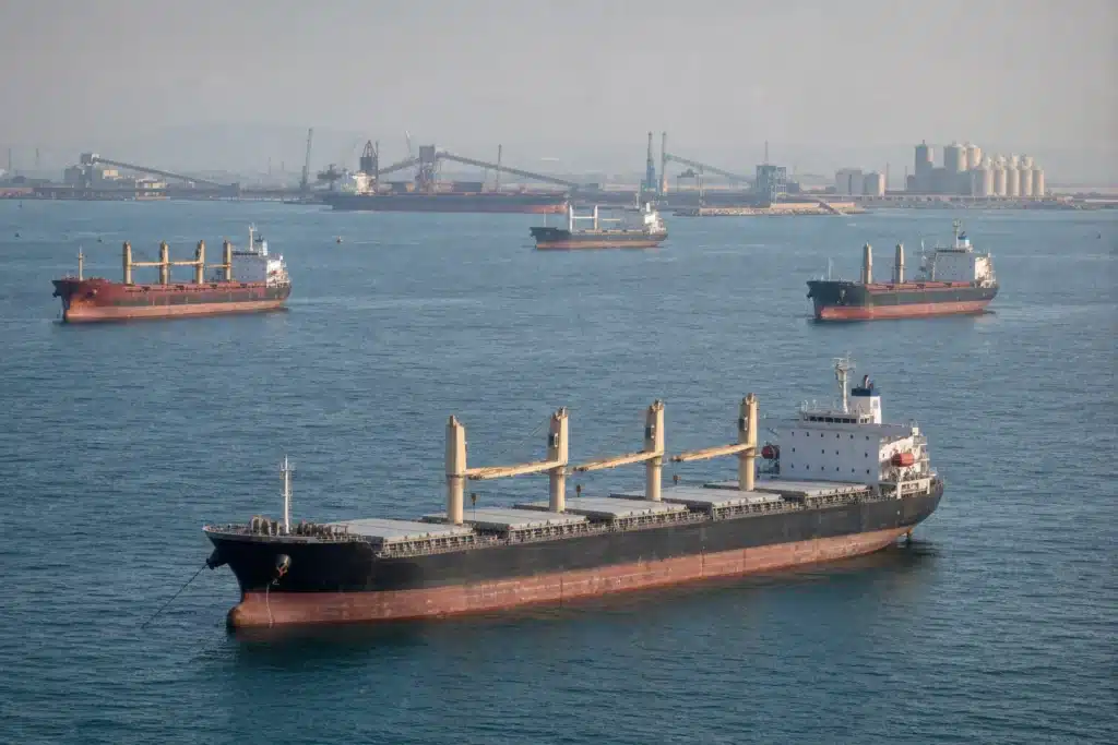 Dry bulk carriers waiting at a congested commercial port anchorage